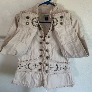 Tween to small women sz. Brass studs & ruffles are a great statement piece